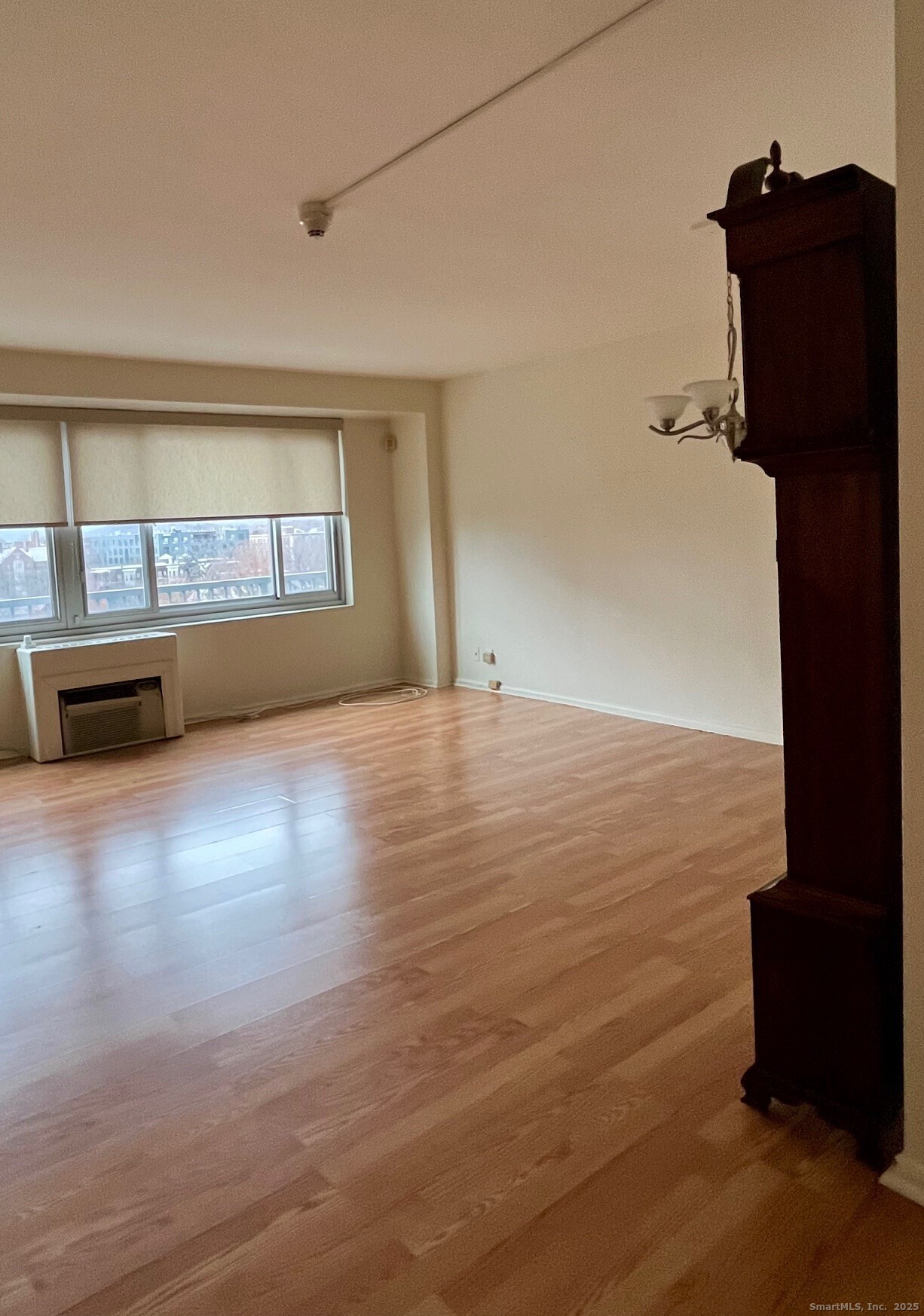 100 York Street, Unit 9B New Haven, CT 06511 - Photo 11 of 17 wooden floor in an empty room with a window
