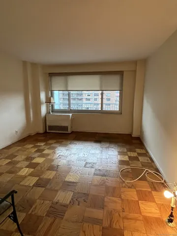 a view of an empty room with a window