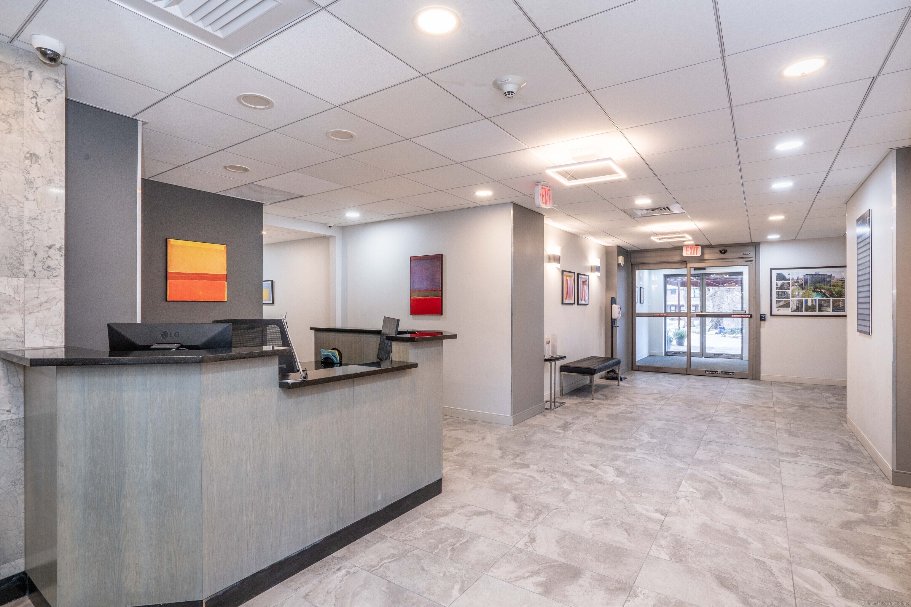 100 York Street, Unit 9B New Haven, CT 06511 - Photo 4 of 17 a view of a big room with a large window and wooden floor