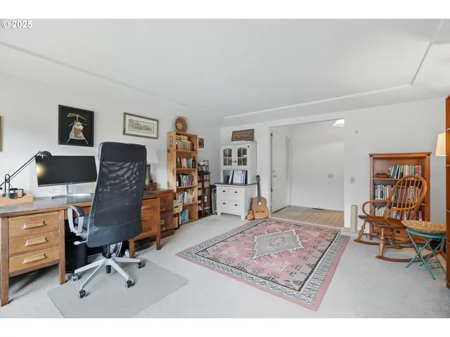 a view of a workspace with furniture and a couch