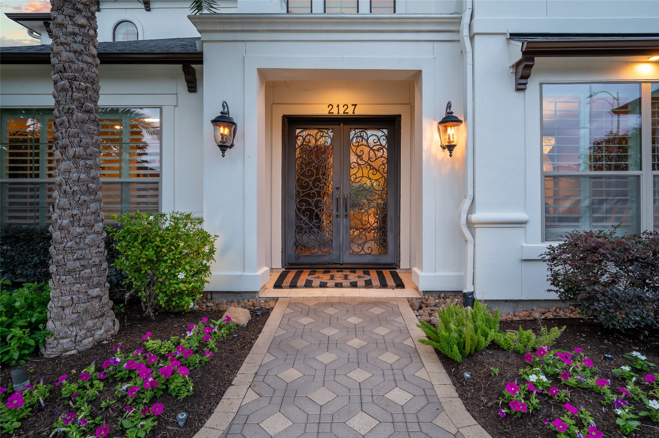 2127 Thicket Ridge Lane Houston, TX 77077 - Photo 5 of 48 Enter this welcoming home through double custom wrought iron front doors that were designed specifically for this residence.