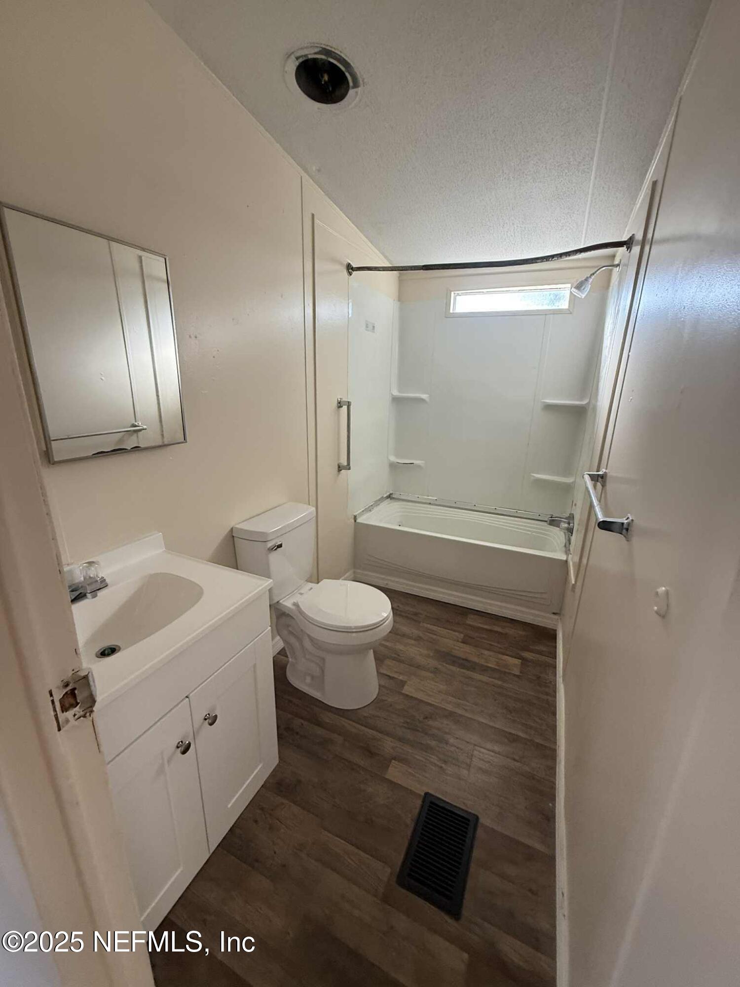 550 Interlachen Boulevard Interlachen, FL 32148 - Photo 12 of 15 a bathroom with a sink a toilet and shower
