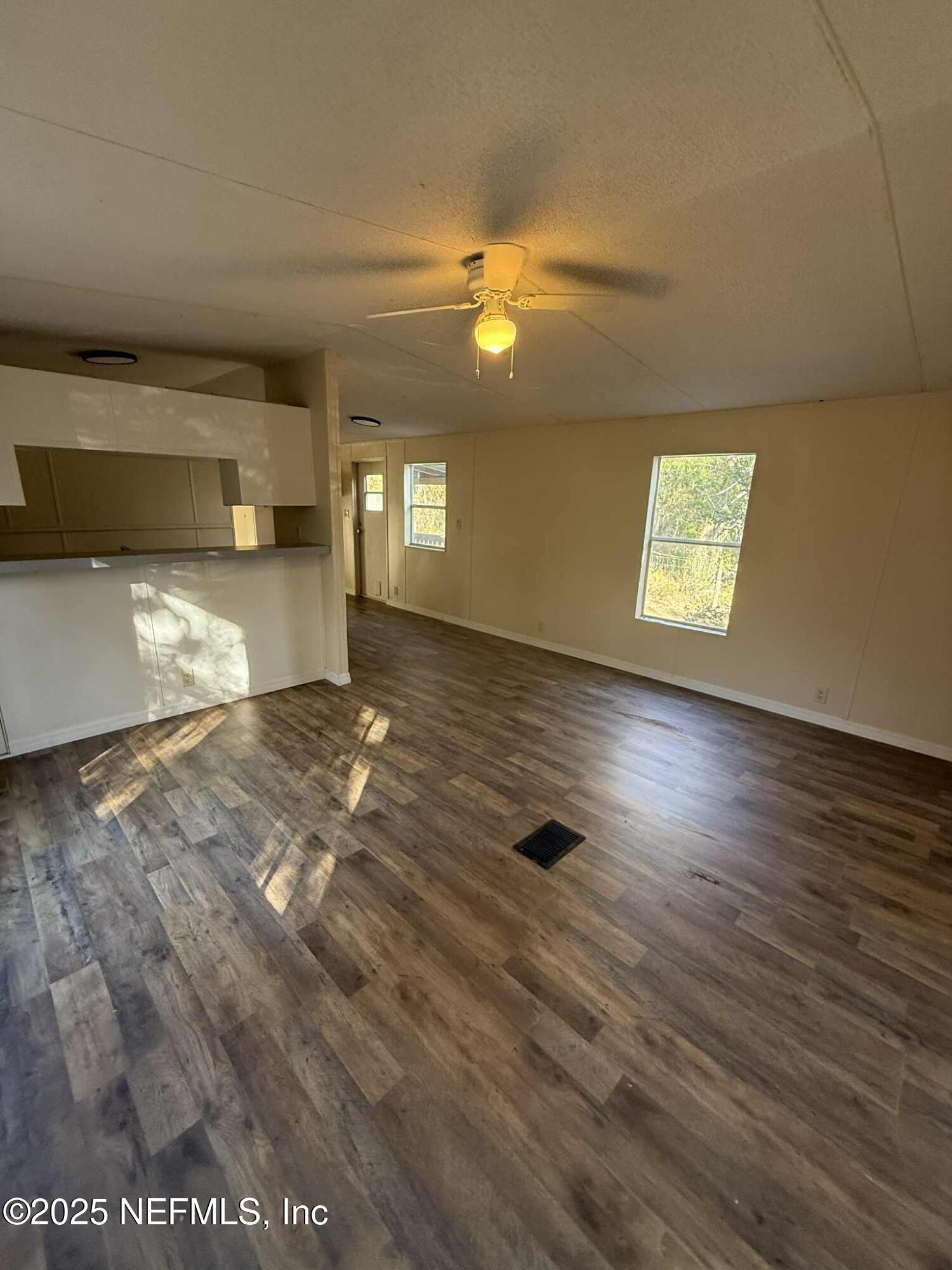 550 Interlachen Boulevard Interlachen, FL 32148 - Photo 4 of 15 a view of empty room with wooden floor