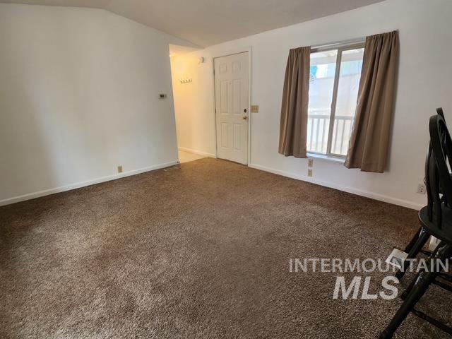 1220 North 4th Street Parma, ID 83660 - Photo 13 of 23 Unfurnished office with dark colored carpet and vaulted ceiling