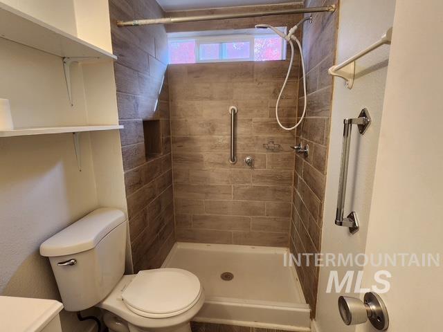1220 North 4th Street Parma, ID 83660 - Photo 20 of 23 Full bath featuring a shower stall and toilet