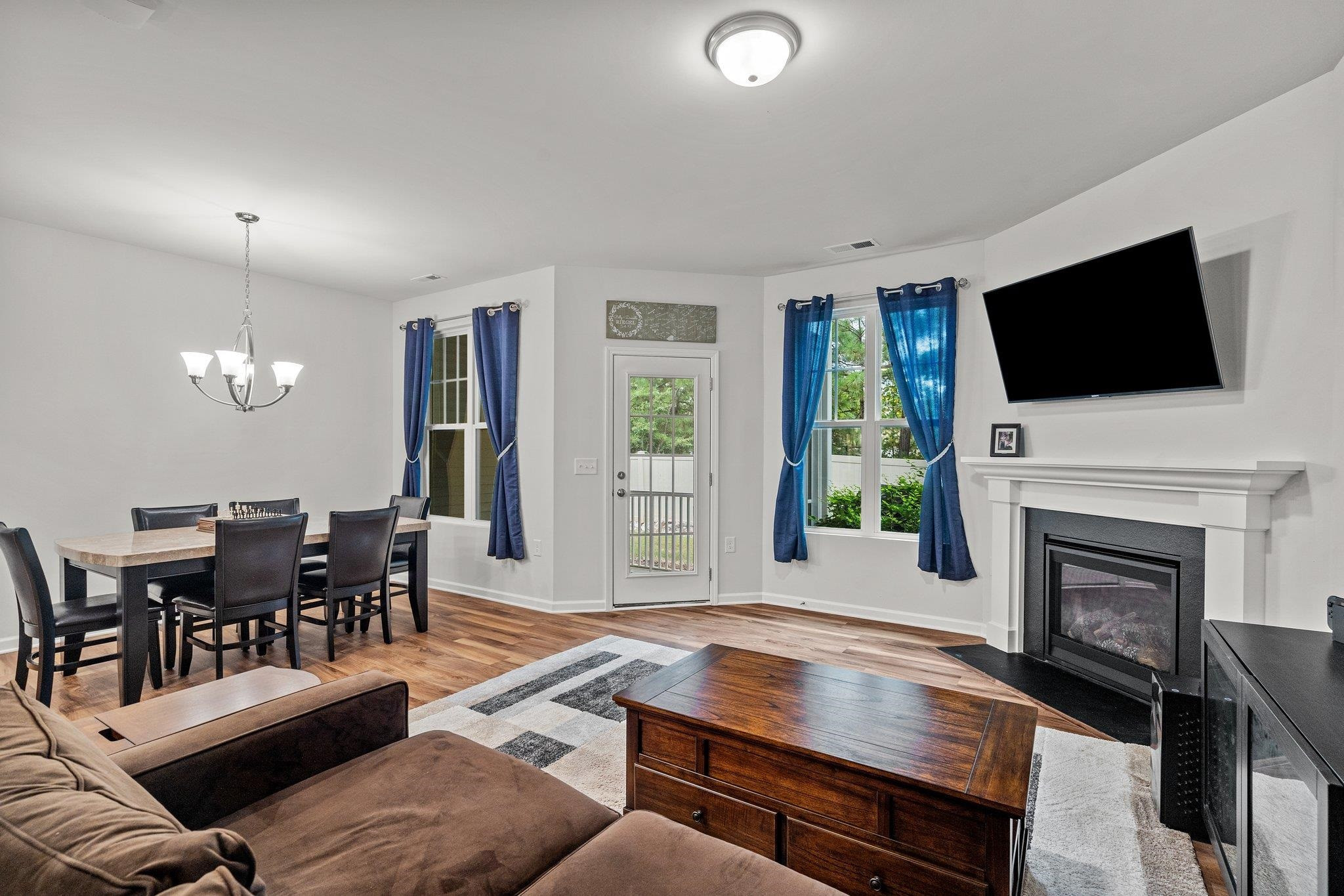 6085 Beale Loop Raleigh, NC 27616 - Photo 12 of 42 a living room with fireplace furniture and a flat screen tv