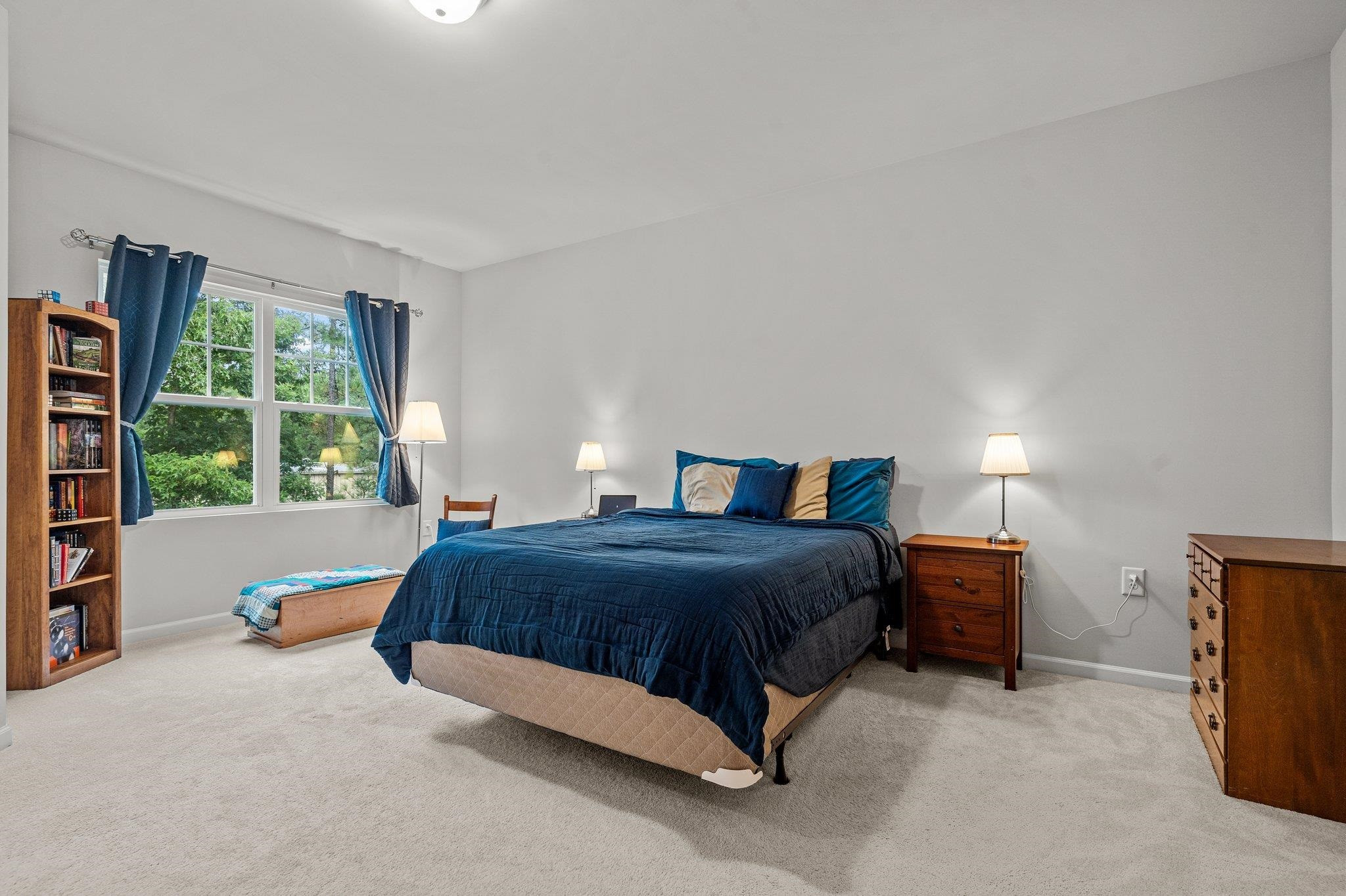 6085 Beale Loop Raleigh, NC 27616 - Photo 18 of 42 a bedroom with a bed and a window