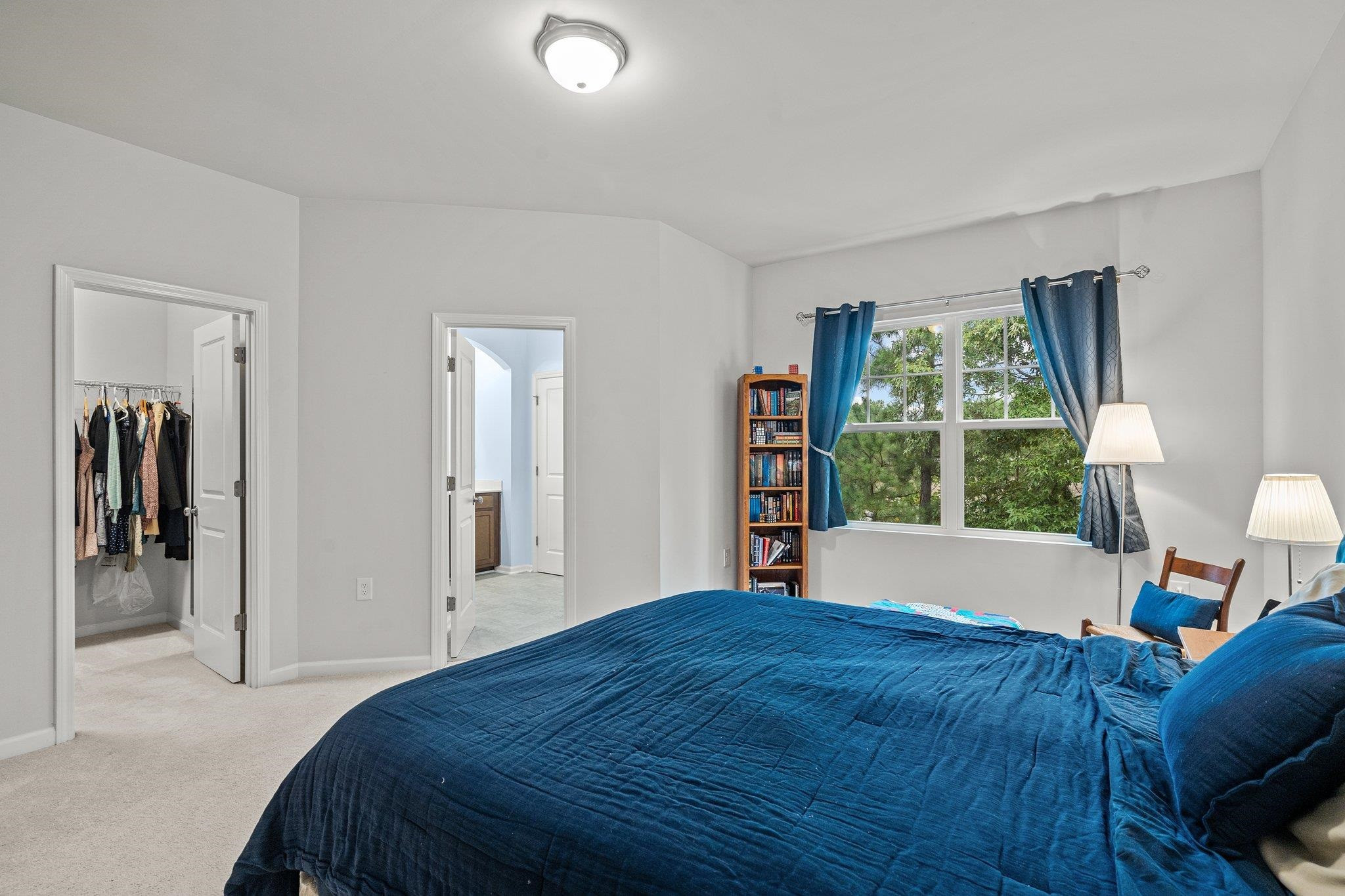 6085 Beale Loop Raleigh, NC 27616 - Photo 20 of 42 a bedroom with a large bed and a window