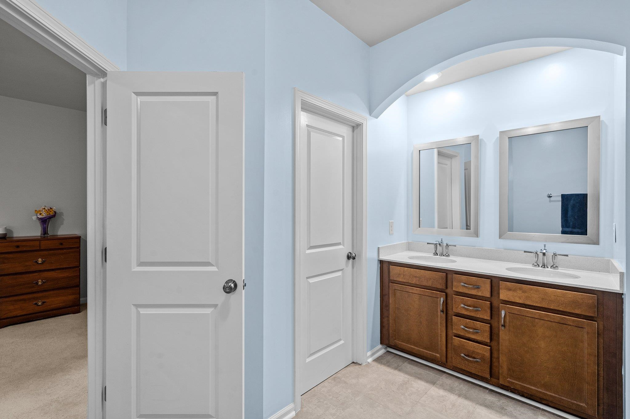 6085 Beale Loop Raleigh, NC 27616 - Photo 22 of 42 a spacious bathroom with a double vanity sink a mirror and a bathtub