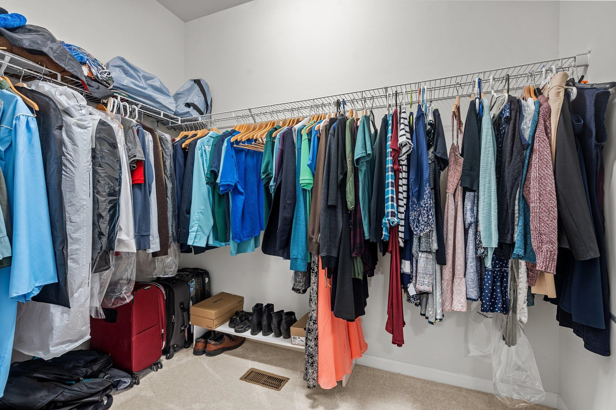 6085 Beale Loop Raleigh, NC 27616 - Photo 23 of 42 a view of walk in closet with clothes