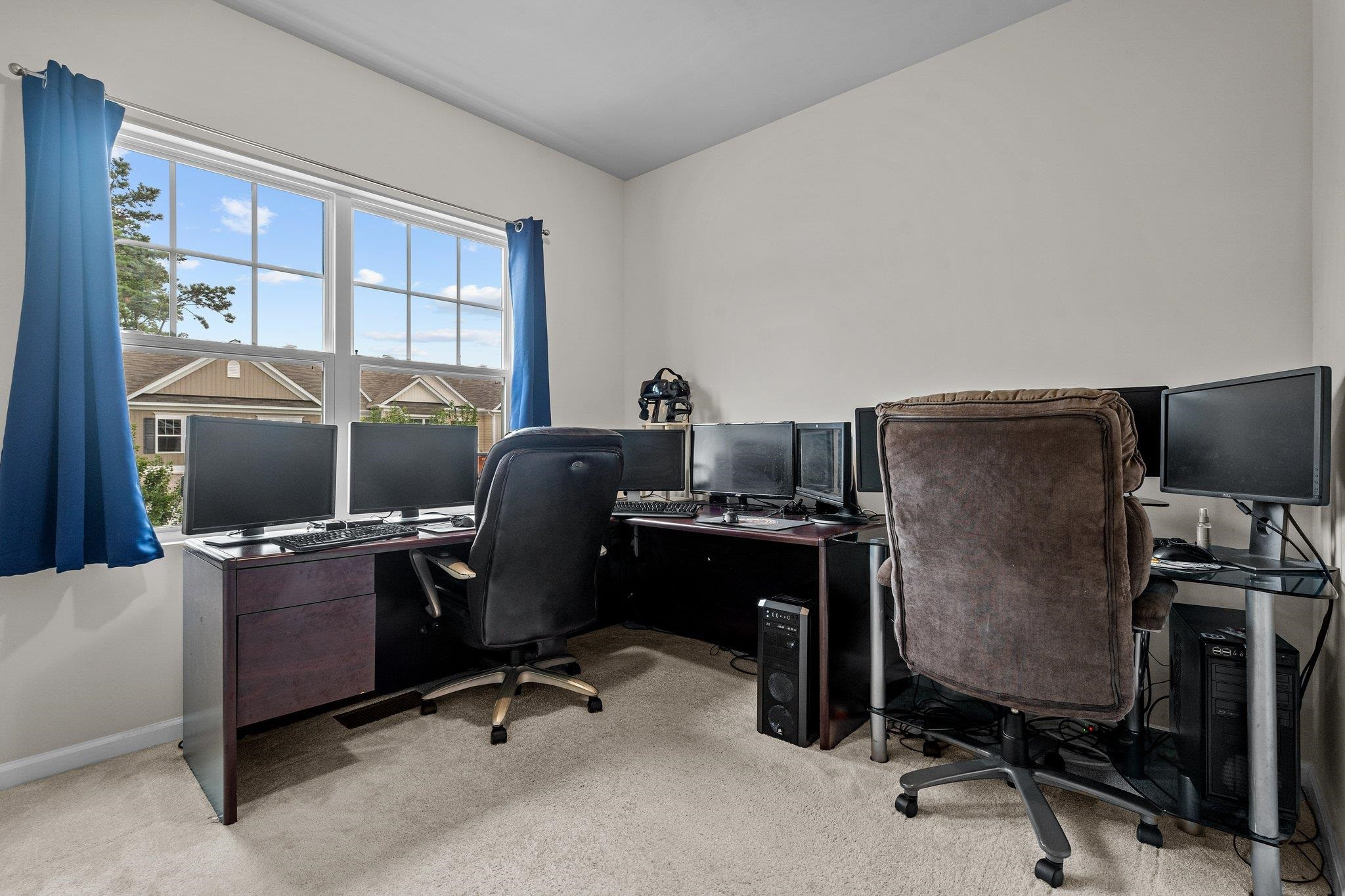 6085 Beale Loop Raleigh, NC 27616 - Photo 27 of 42 a view of a workspace with furniture and a window
