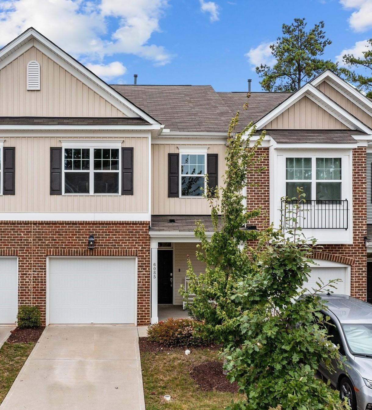 6085 Beale Loop Raleigh, NC 27616 - Photo 34 of 42 a front view of a house with a yard and garage