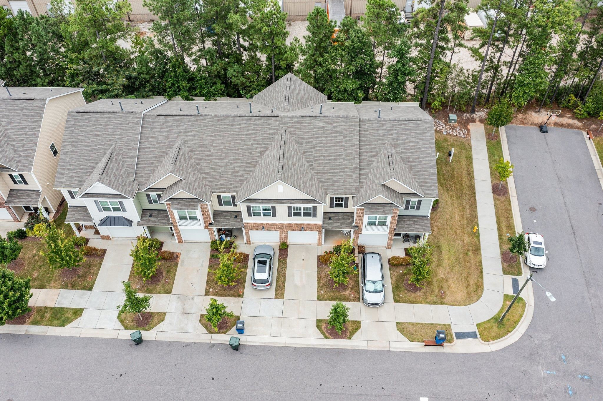 6085 Beale Loop Raleigh, NC 27616 - Photo 40 of 42 an aerial view of residential houses with street
