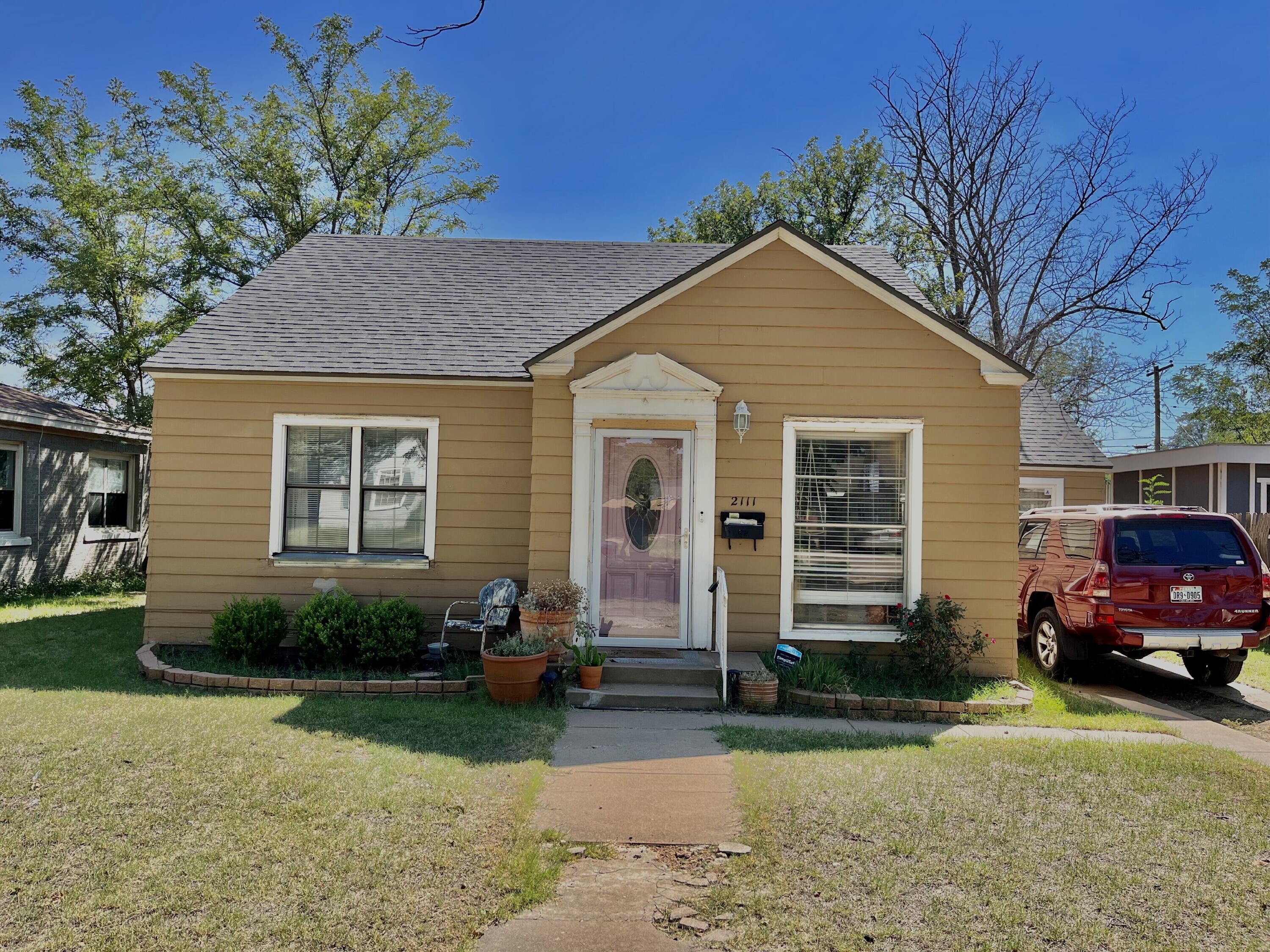a front view of a house with garden