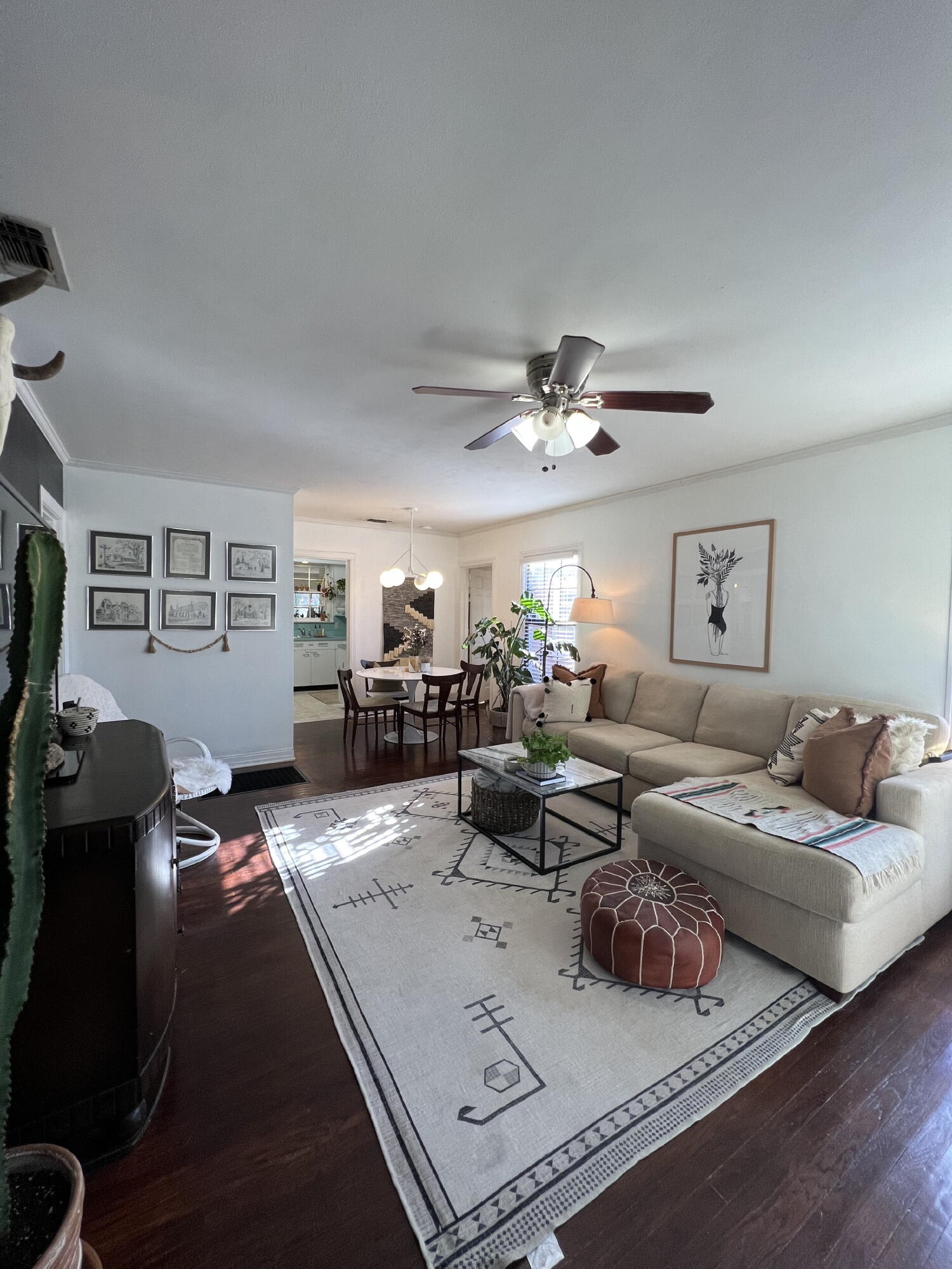 2111 23rd Street Lubbock, TX 79411 - Photo 3 of 15 a living room with furniture and a chandelier