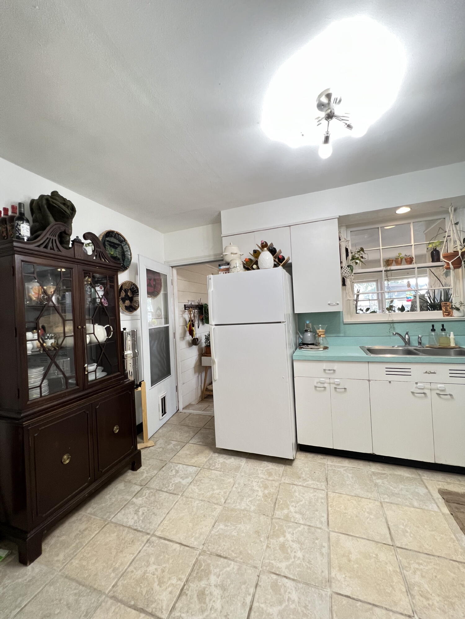 2111 23rd Street Lubbock, TX 79411 - Photo 4 of 15 a utility room with cabinets