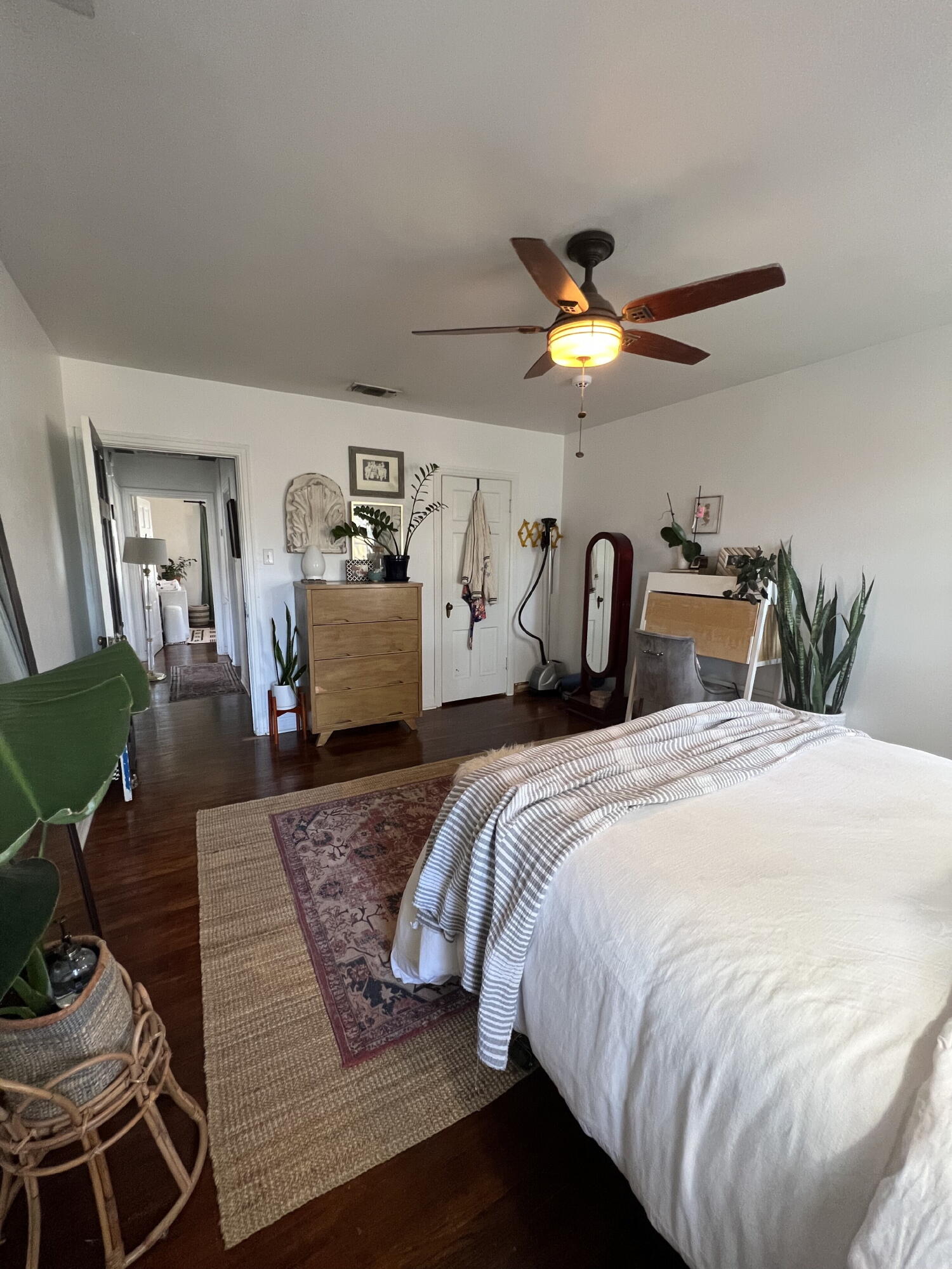 2111 23rd Street Lubbock, TX 79411 - Photo 7 of 15 a bedroom with a bed and a chandelier