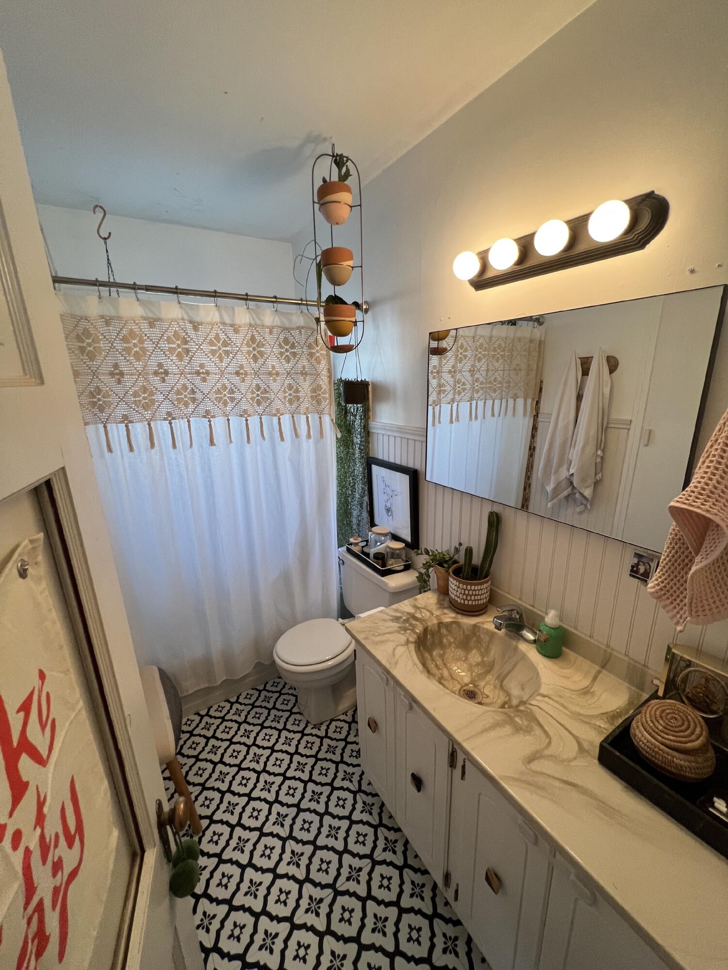2111 23rd Street Lubbock, TX 79411 - Photo 8 of 15 a bathroom with a sink toilet and shower