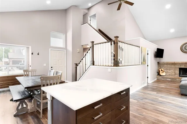 a living room with table and chairs