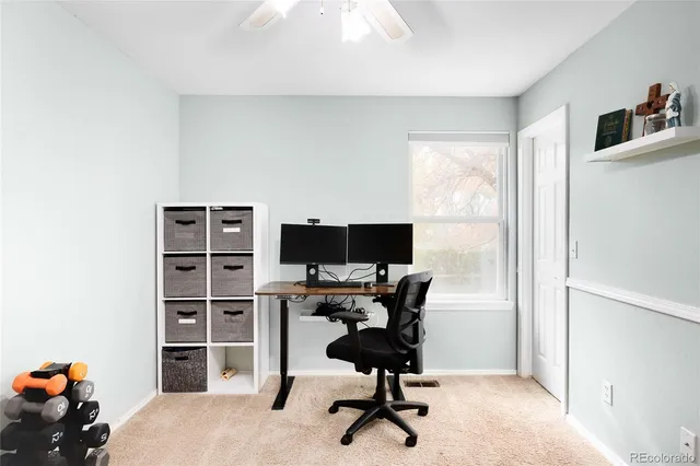 a view of a workspace with furniture
