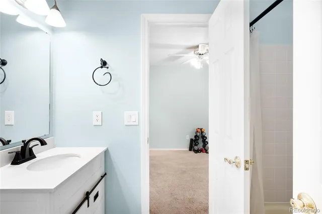 a bathroom with a sink and mirror