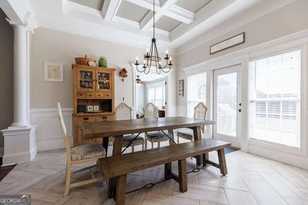 a view of a dining room with furniture window and outside view