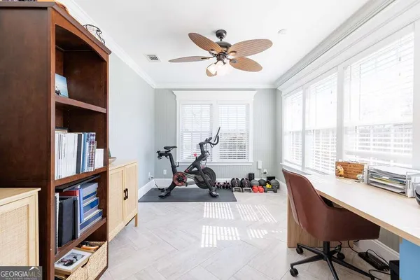 a work room with furniture and a window