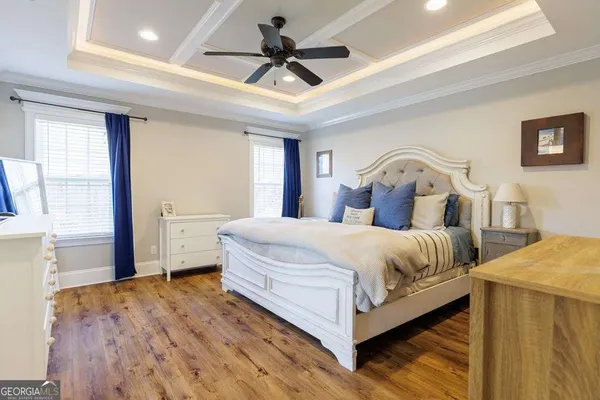 a bed room with a bed and a chandelier
