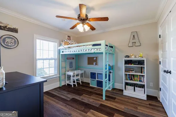 a living room with fireplace furniture and a window