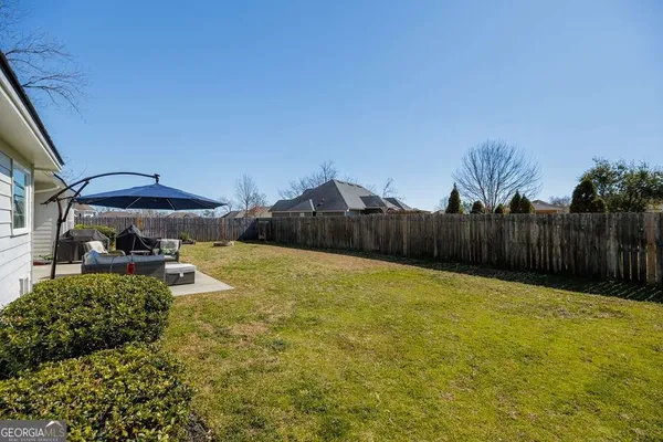 a swimming pool with wooden fence