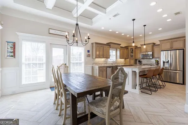 a dining room with furniture and window