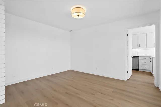 a view of a room with wooden floor