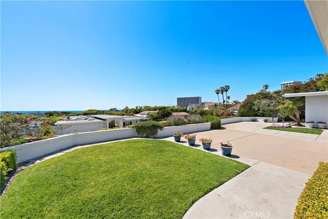 a house with yard and a wooden fence