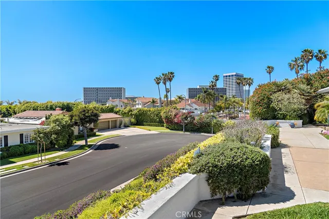 a view of a house with swimming pool and a yard