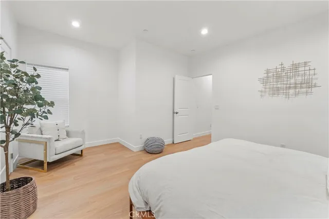 a kitchen with a sink a stove a refrigerator and cabinets