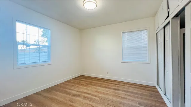 a view of kitchen with cabinets and wooden floor