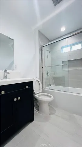 a kitchen with stainless steel appliances granite countertop a stove a microwave and a refrigerator