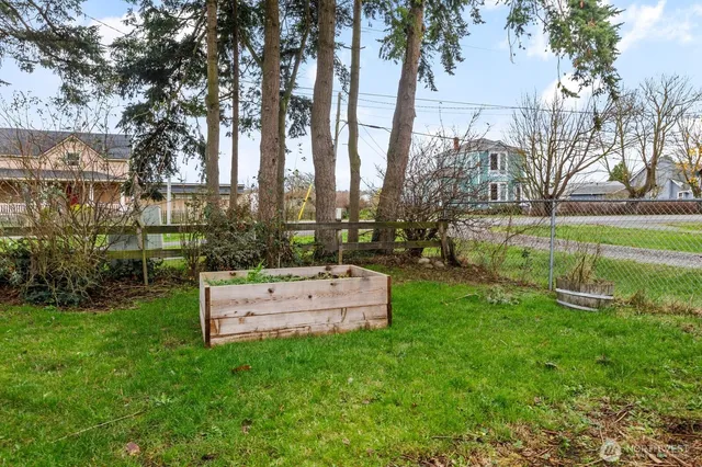 a view of a house with backyard porch and sitting area