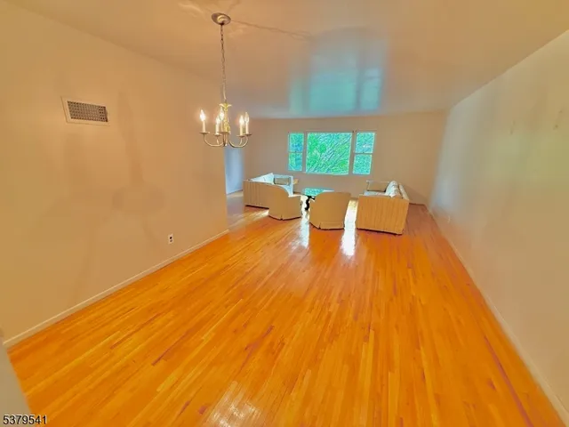 a view of a dining room with a wooden floor