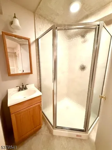 a bathroom with a sink mirror vanity and window