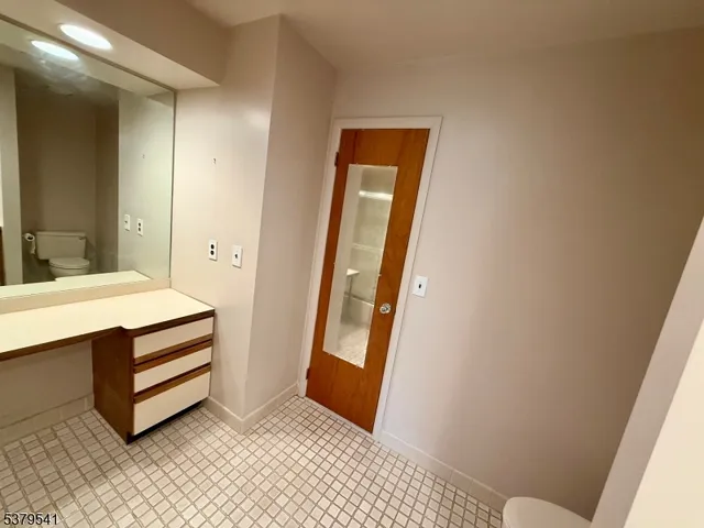 a room with a chair and a door