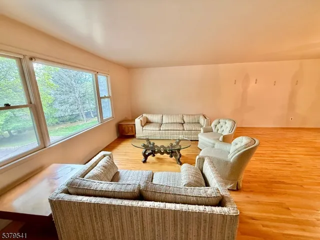 a living room with furniture and a table