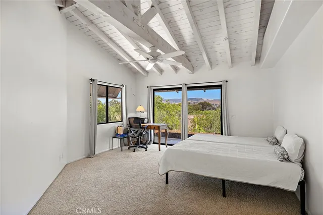 a bedroom with a bed and a table