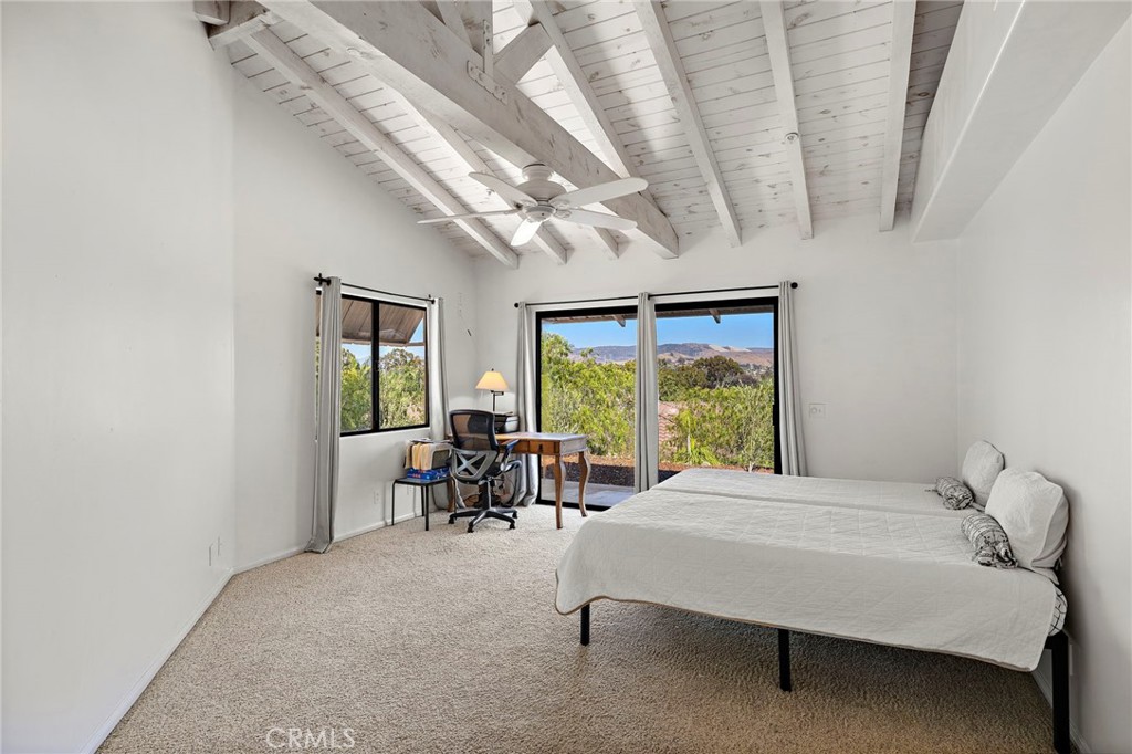 31645 Rancho Viejo Road San Juan Capistrano, CA 92675 - Photo 7 of 10 a bedroom with a bed and a table