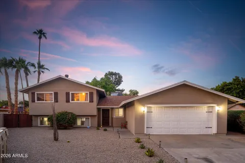 a living room with furniture and flowers