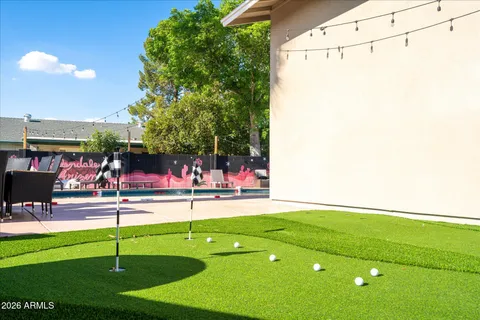 a view of a dining room with furniture and a flat screen tv