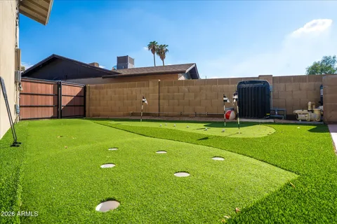 a view of a dining room with furniture and a window