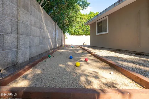 a kitchen with white cabinets and appliances