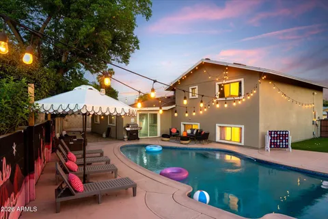 a view of a patio with swimming pool