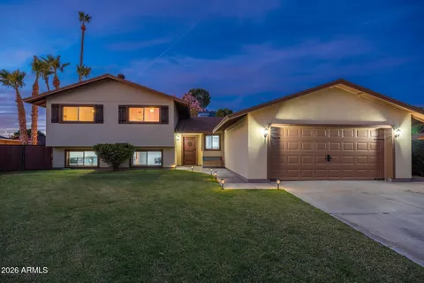 a bathroom with a sink a toilet and a shower
